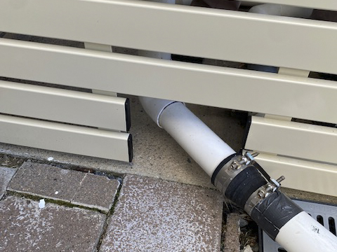 Aluminium slats cut so pipes can fit through