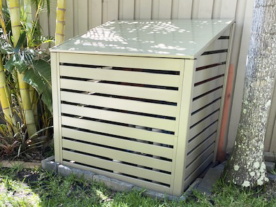 Filter Cover with a sloping lid set in the trees.