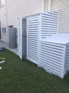 Full height shed beside pool filter cover